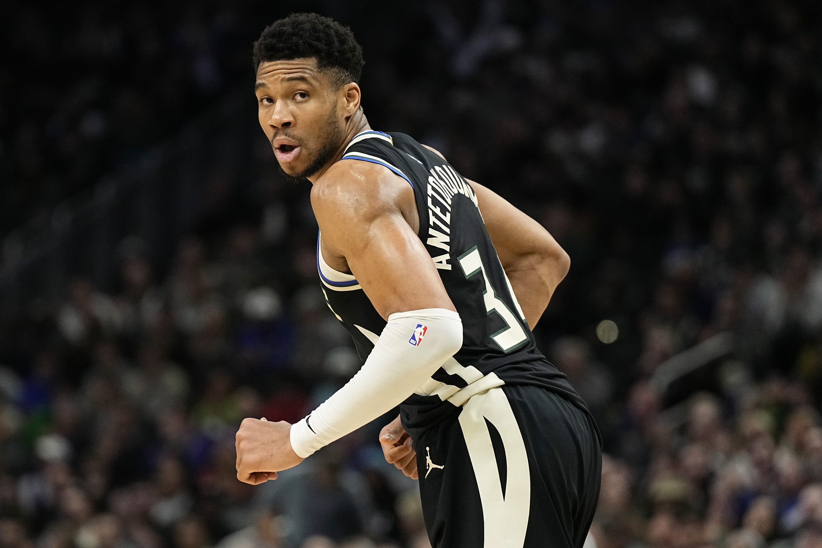 Milwaukee Bucks forward Giannis Antetokounmpo (34) looks over his shoulder 